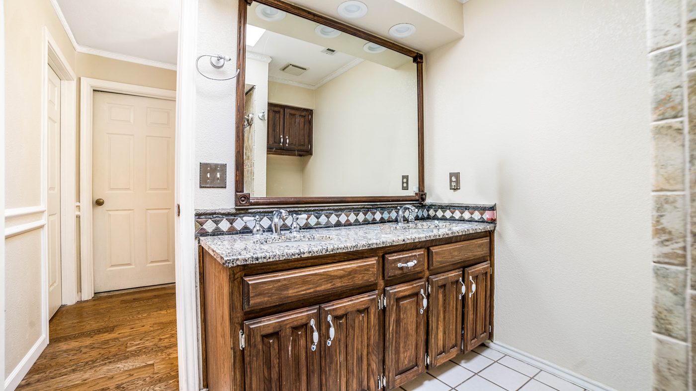 Bathroom vanity with granite counter at Baffin Bay