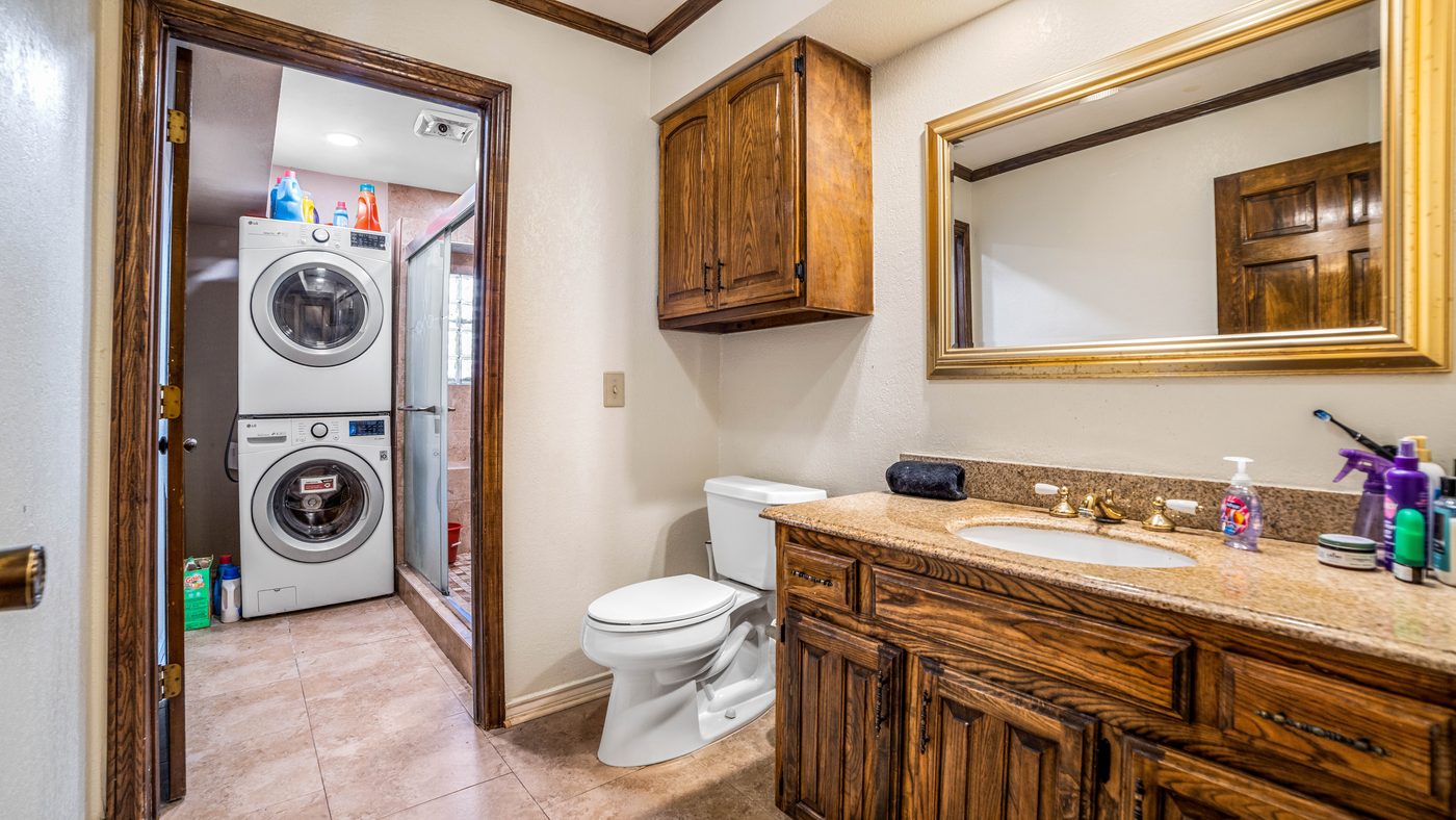 Bathroom with vanity and laundry closet at Baffin Bay