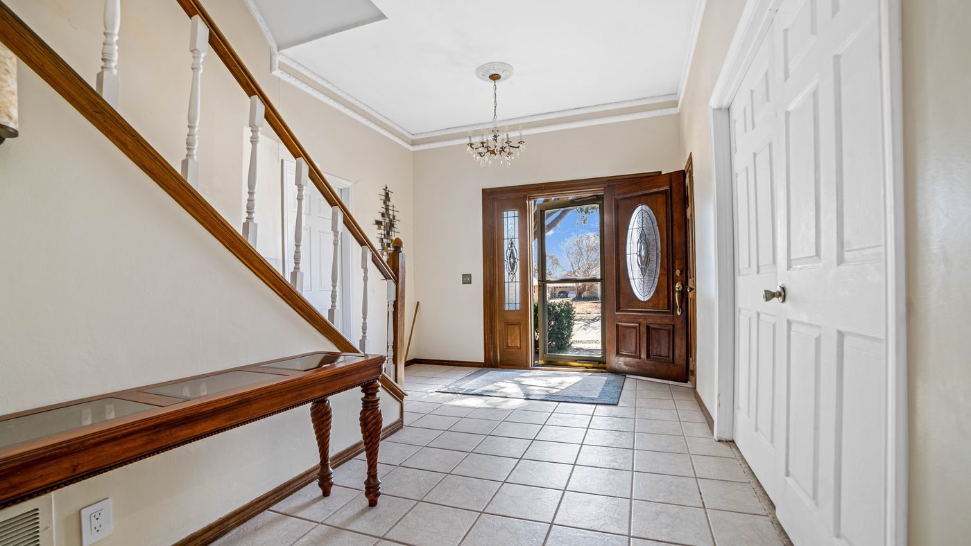 Entry hall with tile floor and staircase at Baffin Bay