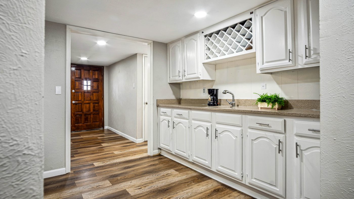 Entry hall with coffee bar and white cabinets at Blue Ridge
