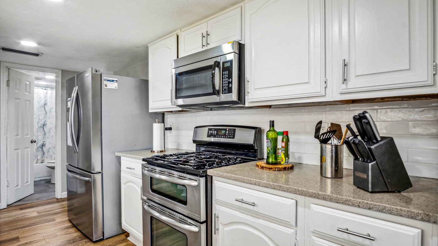 Gas range and white cabinets in the Blue Ridge kitchen