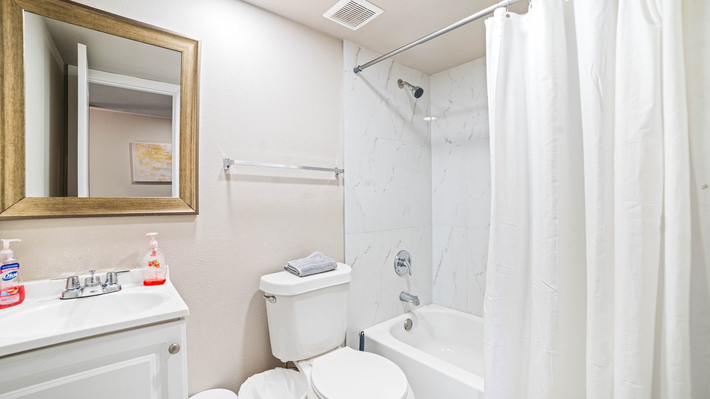 Bathroom with tub and shower at Chinaberry