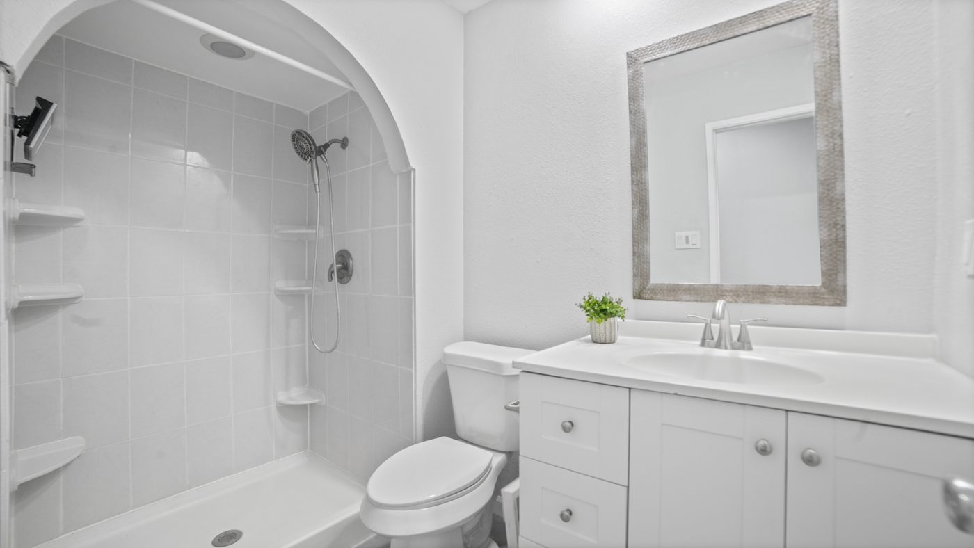 Bathroom with arched shower alcove at John Muir