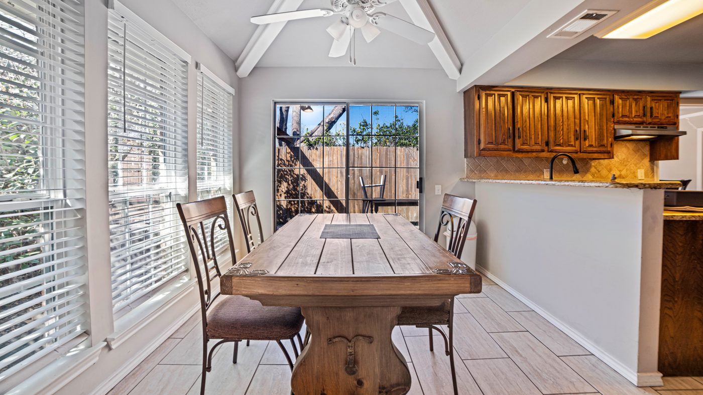 Breakfast room with farmhouse table and windows at Matterhorn