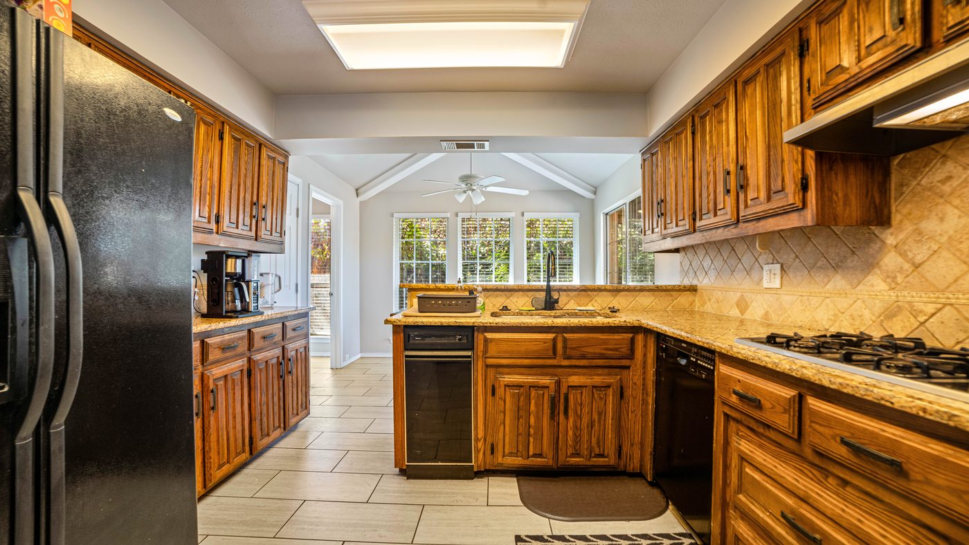 Kitchen with wood cabinets and gas cooktop at Matterhorn