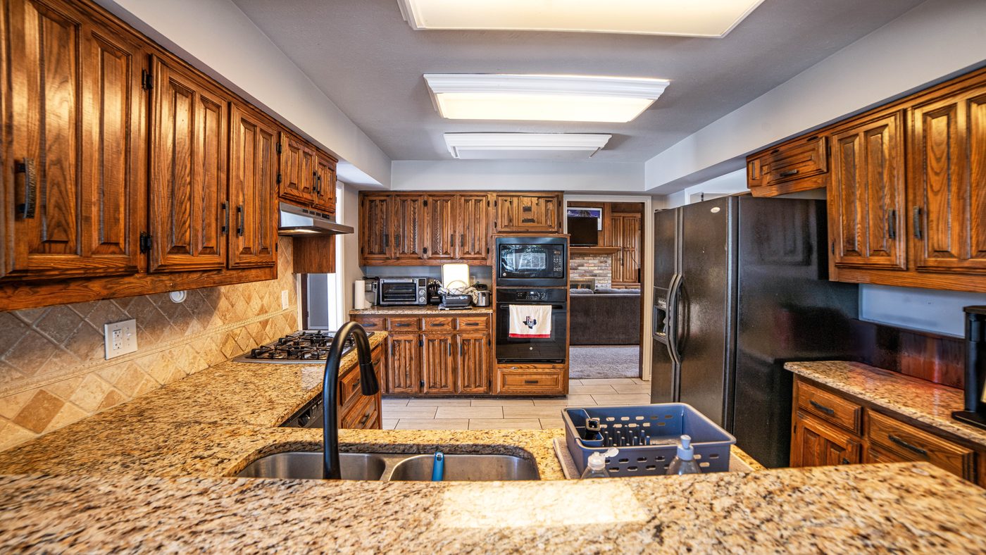 Kitchen with granite counters and double ovens at Matterhorn