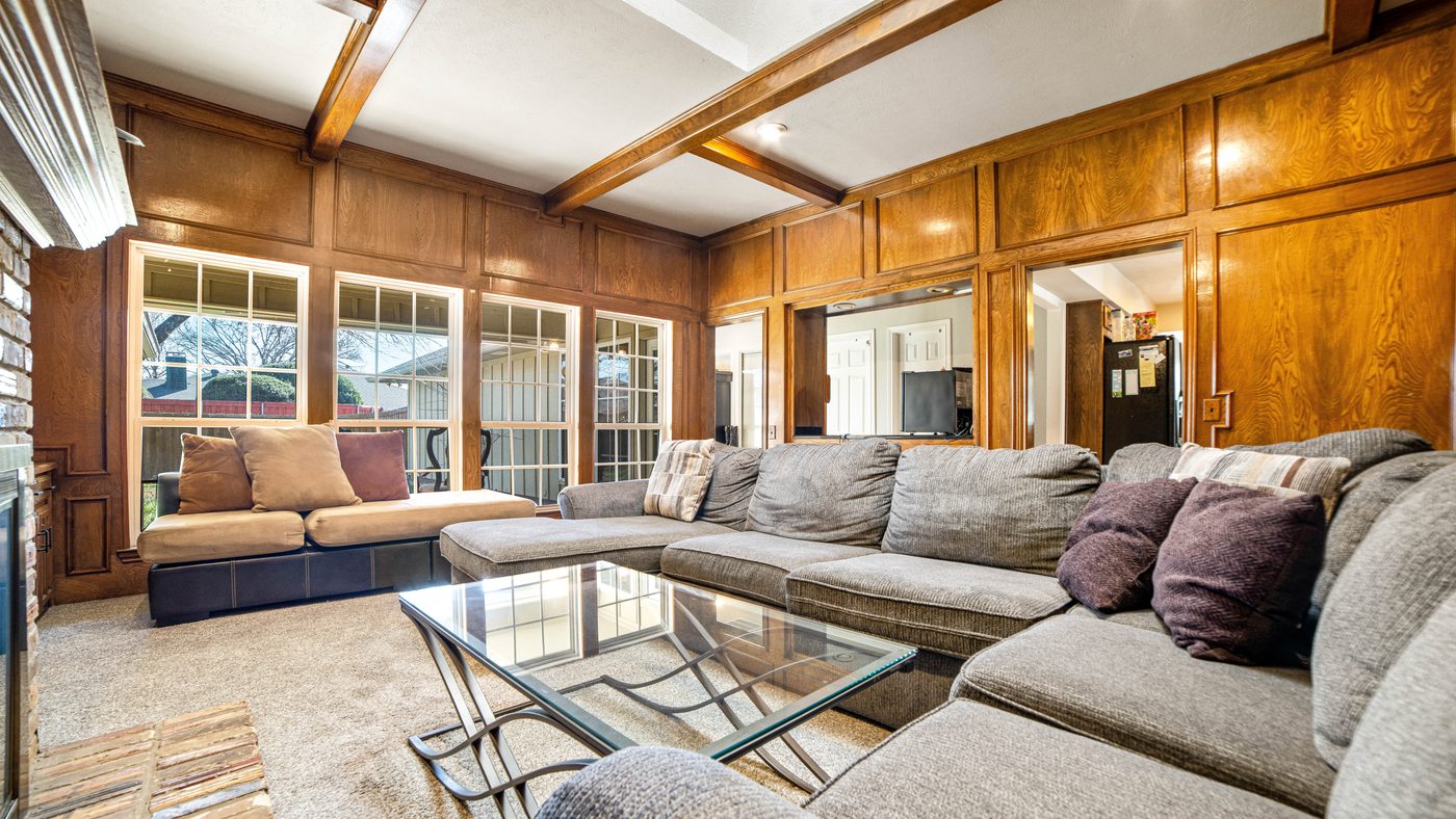 Wood-paneled living room with beamed ceiling at Matterhorn