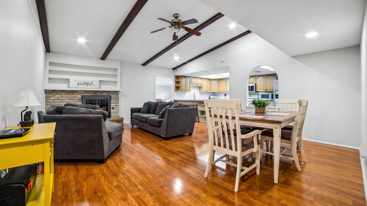 Living room with fireplace and beamed ceiling at Overdowns