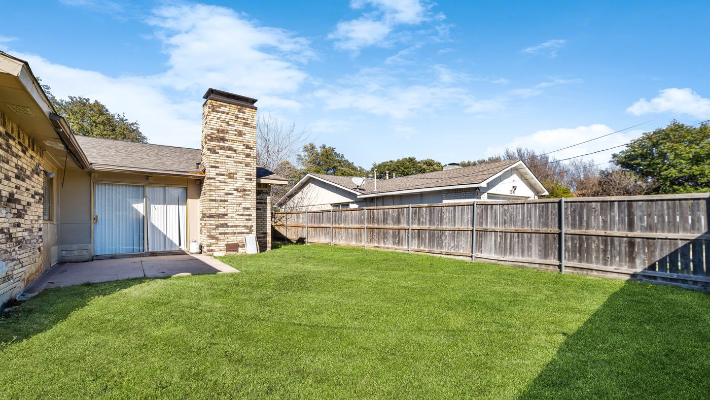 Fenced backyard lawn at Spring Creek