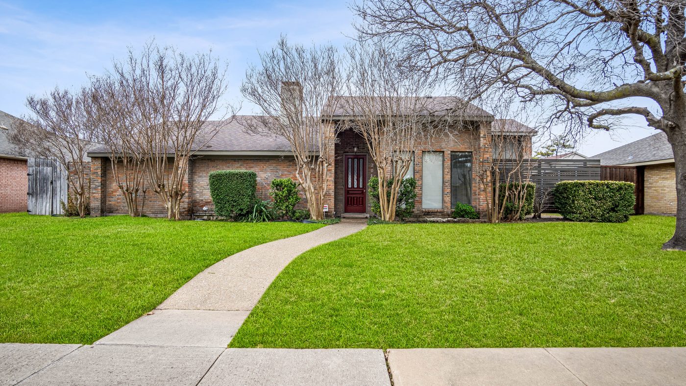 Brick front of Stain Glass with curved walkway and crape myrtles