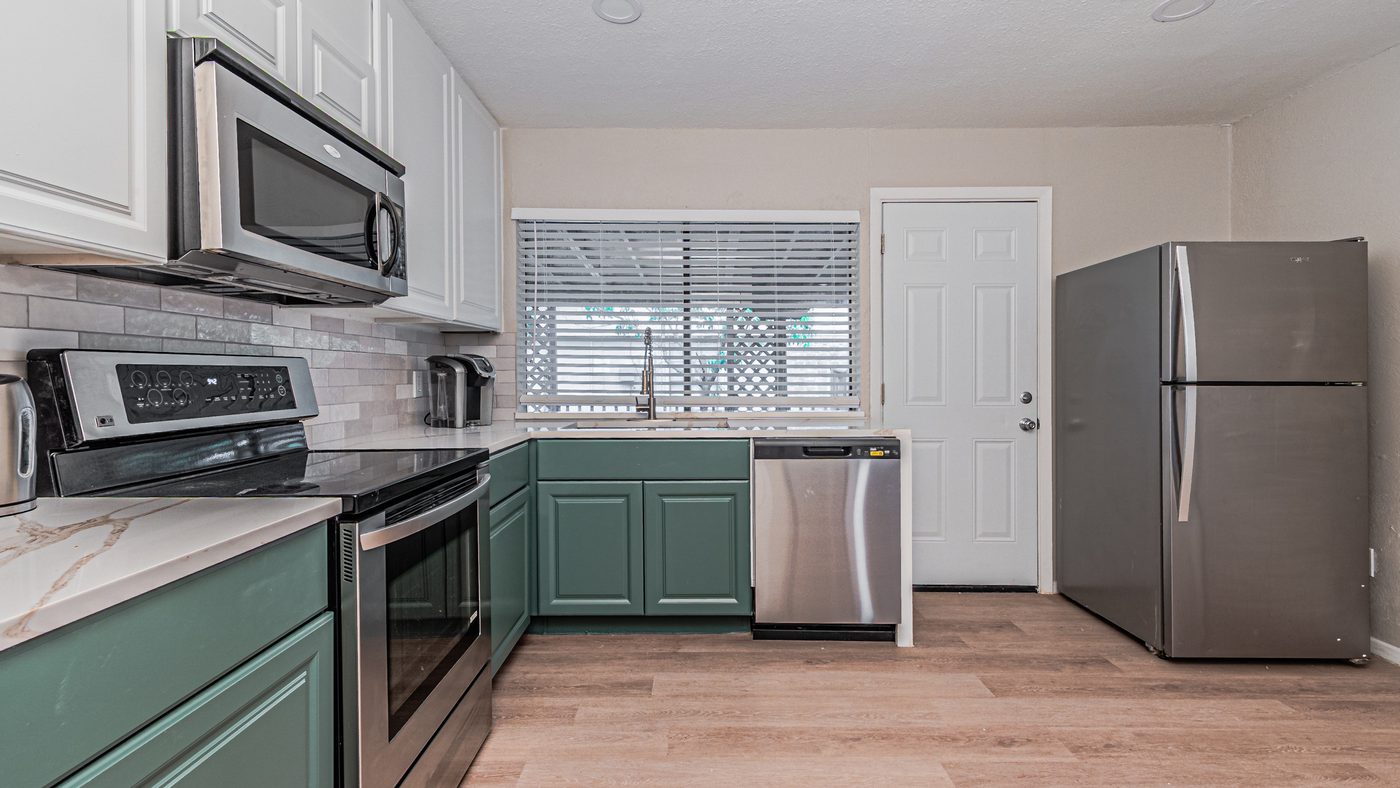 Kitchen range, sink window and refrigerator at Yosemite